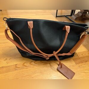 Lulu’s large travel tote bag luggage